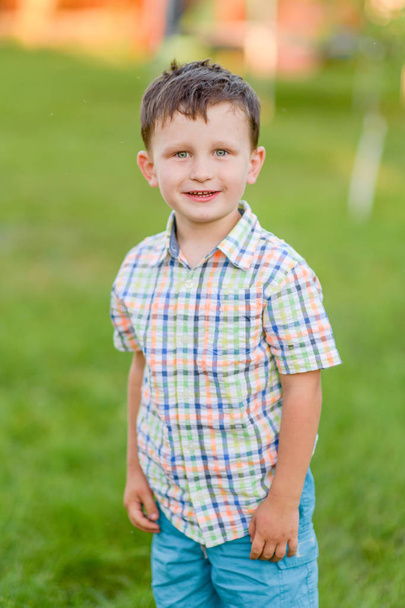 Portrait of a boy in the summer outdoors - Foto, imagen