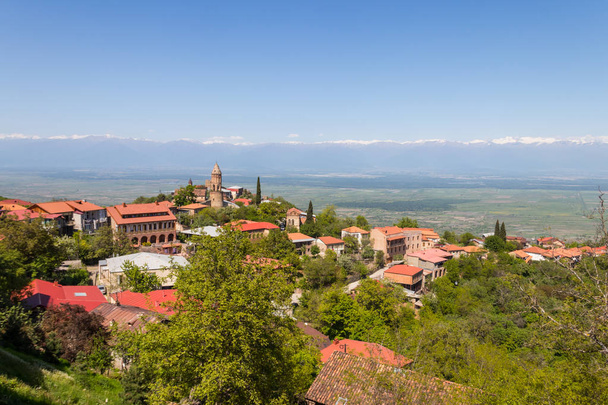 View on the Sighnaghi town and Caucasian mountains in Kakheti region, Georgia - Zdjęcie, obraz