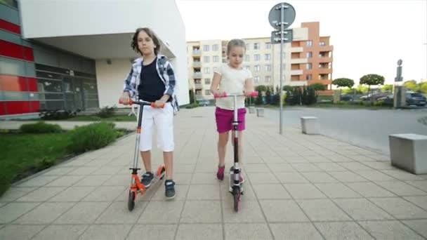 Happy Kids Are Riding On Kick Scooter Outdoor. They Have A Lot of Fun Playing Together. - Imágenes, Vídeo