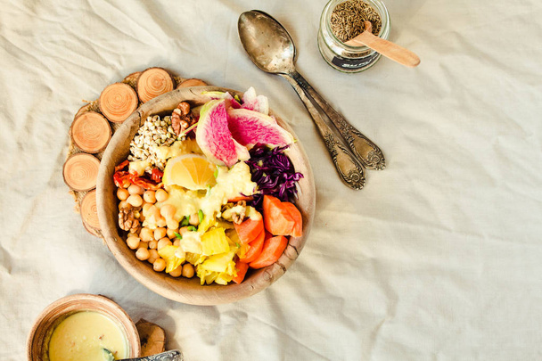 Healthy vegan lunch/dinner bowl in wooden dishes - Zdjęcie, obraz
