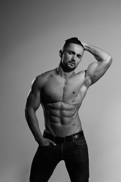 bodybuilder with muscular body in jeans - Foto, Imagen