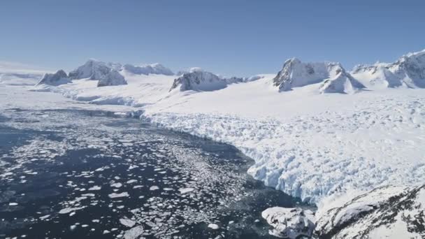 Aerial flight over snow, ice Antarctica shoreline. - Footage, Video