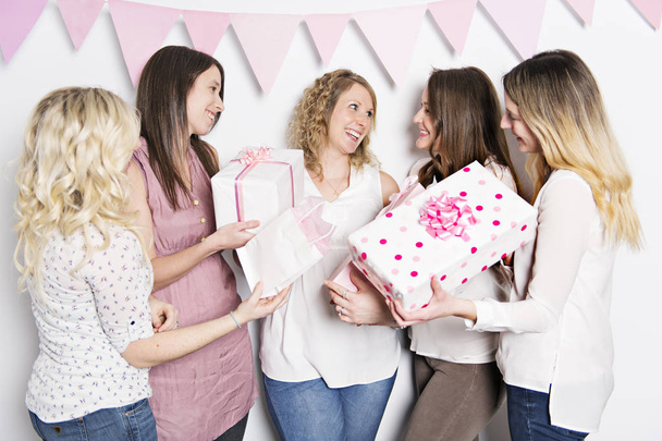 Best Friends on baby shower party celebrating giving kid stuff as present - Fotoğraf, Görsel