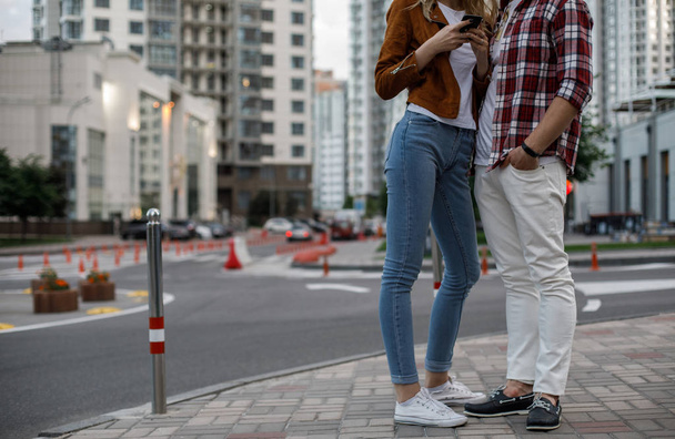 Urban pair of young people standing at street - Fotó, kép