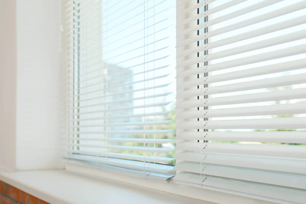 New modern window with blinds indoors. Home interior - Foto, imagen