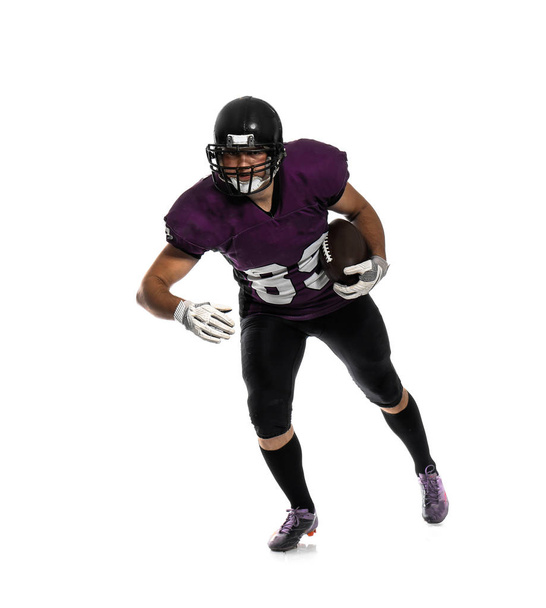 American football player with ball on white background - Фото, зображення