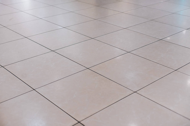 Beige tile on the floor in perspective - Photo, Image