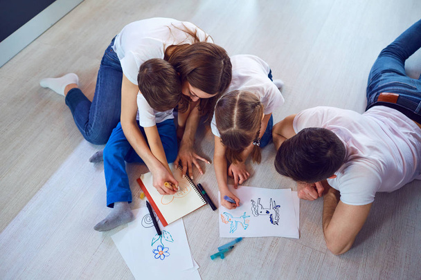 Top view of family drawing on the floor - Foto, Imagen
