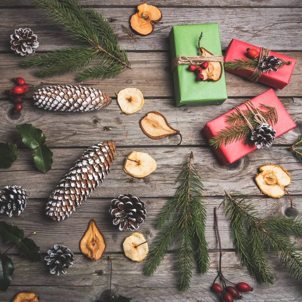 New Year composition of flowers, gifts on a wooden table. Christmas background. Flat lay.Top view - Fotó, kép