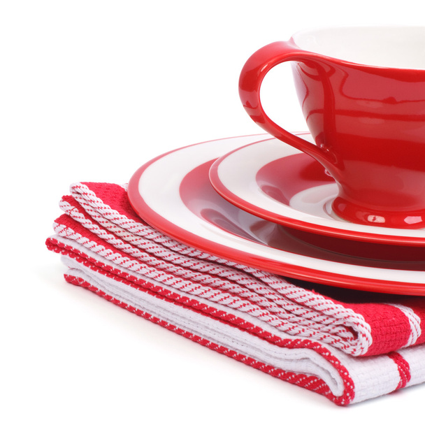 Beautiful red tea cup and saucer on a striped napkin - Φωτογραφία, εικόνα