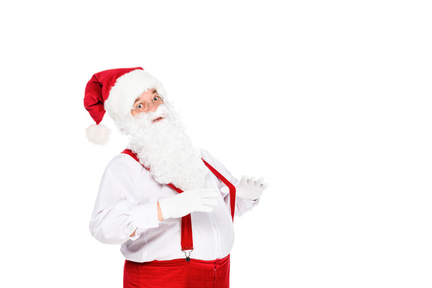 emotional santa claus in suspenders looking at camera isolated on white - Foto, imagen