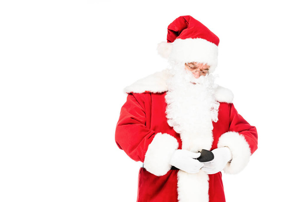 santa claus tying up his belt isolated on white - Fotó, kép