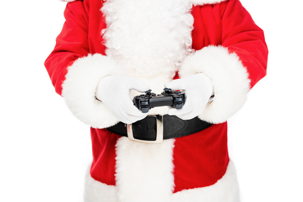 обрізаний знімок Санта-Клауса грає в відеогру з геймпад ізольовані на білому
 - Фото, зображення