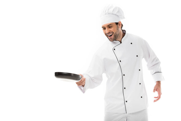 happy young chef cooking with frying pan isolated on white - Photo, Image