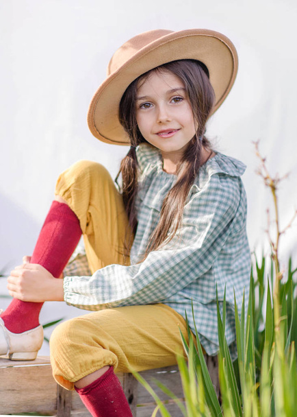 portrait of little girl outdoors in summer - Fotó, kép