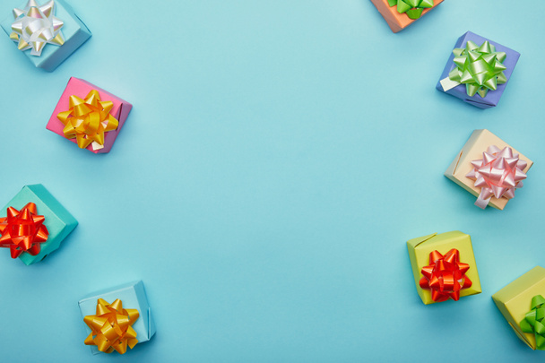 Top view of colorful gifts on blue background - Photo, Image