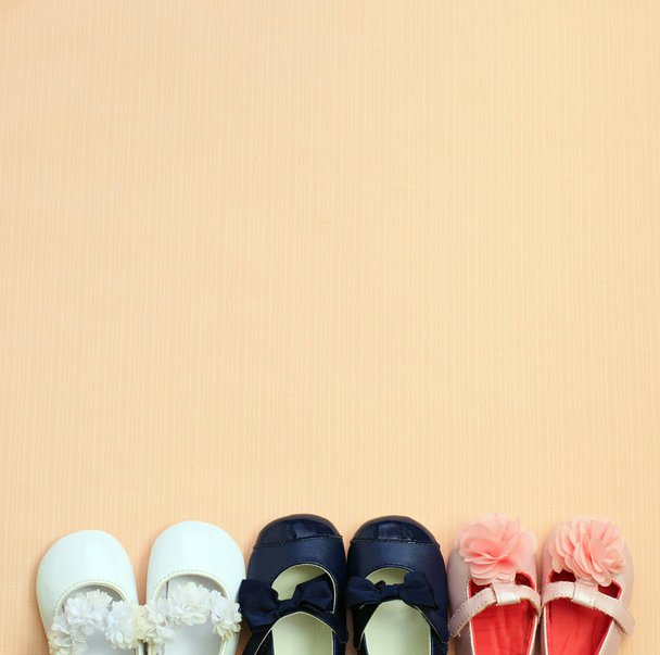 Many cute baby shoe placed on pink background , top view - Photo, Image