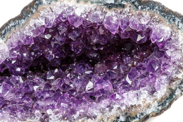 Macro Mineral Stone Amethysts in the rock on a white background close up - Photo, Image
