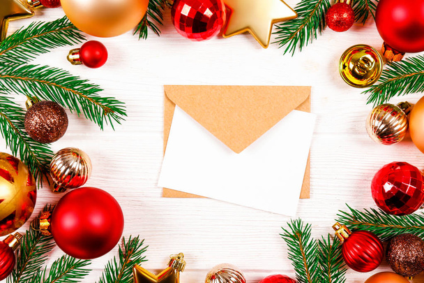 Letter to santa concept. Festive flat lay composition with blank invitation for new year celebration & craft paper envelope. Christmas greeting card template concept. Background, copy space, top view. - Φωτογραφία, εικόνα