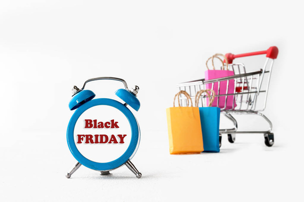 online shoppionline shopping / e-commerce sale and delivery service concept, discounts, black Friday, sale: shopping cart multicolored packages and boxes with trolleybus logo on white background, - Fotó, kép