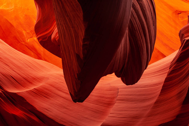 Brilliant colors of Upper Antelope Canyon, the famous slot canyon in the Navajo reservation near Page, Arizona, USA. Beautiful view of amazing sandstone formations in the famous antelope canyon on a sunny day. - Photo, Image