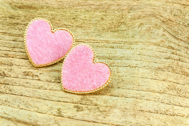Couple of pink hearts over wooden background - Foto, imagen