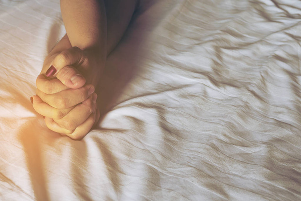 Man holding woman hand on white bed, couple sexual concept - Foto, afbeelding
