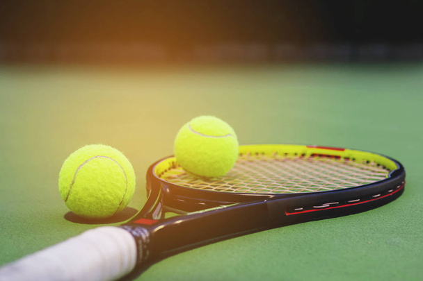 Tennis racket with balls on court - Foto, Imagen