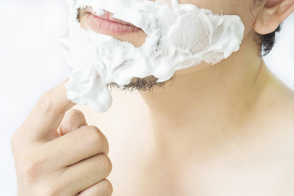 Man is smearing foam to his face prepare for shaving - Zdjęcie, obraz