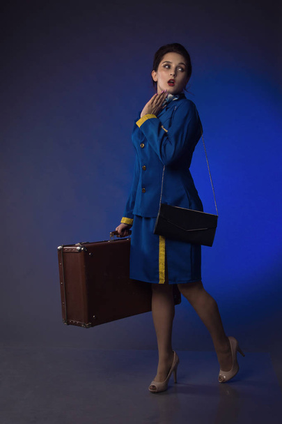 beautiful young pinup girl in suit of stewardess - Foto, immagini