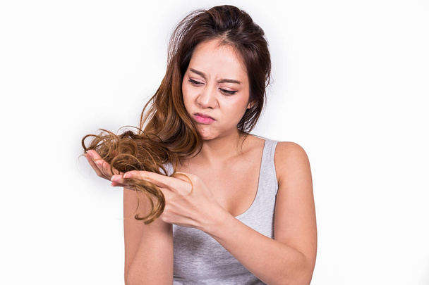 Asian women are worried about hair loss on white background. - Photo, Image
