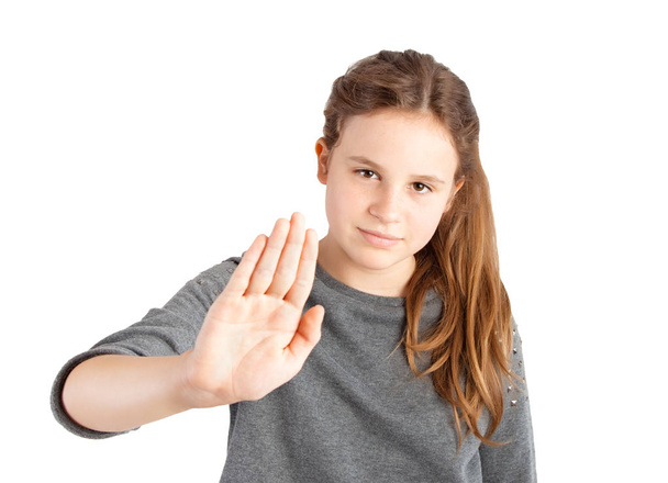 young girl making stop gesture on white background - Photo, image