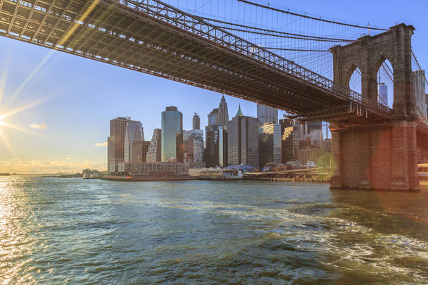Lower Manhattan and Brooklyn bridge from Hudson river in New York City, New York, USA - Photo, image