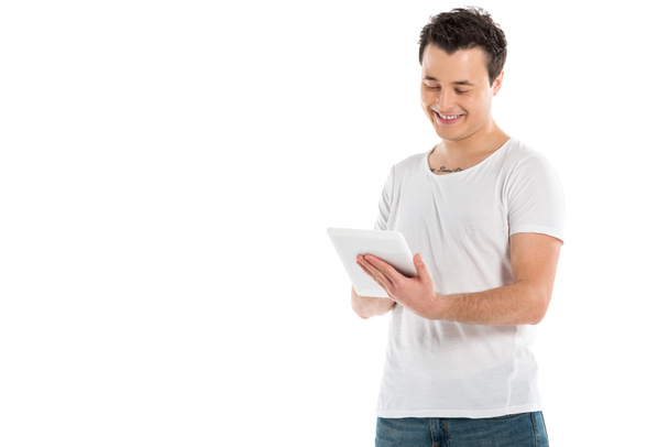 smiling handsome man using digital tablet isolated on white - Fotografie, Obrázek