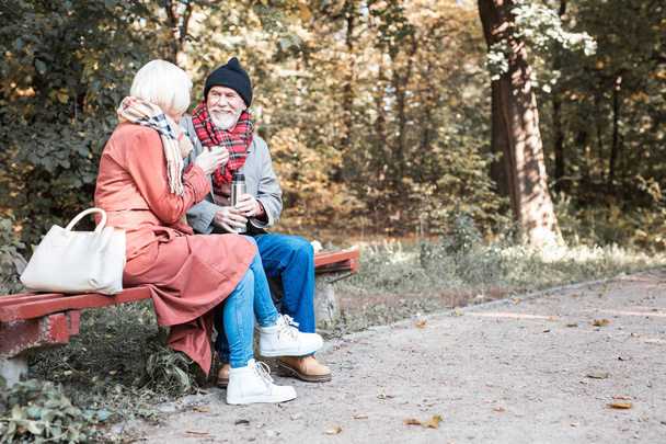 Delighted senior couple talking to each other - 写真・画像
