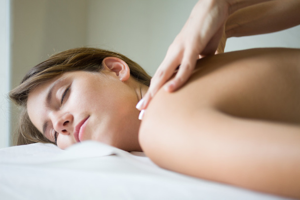 Woman having a massage in a spa - Zdjęcie, obraz