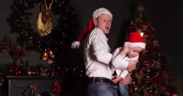 Dad playing with his son at Christmas. - Footage, Video