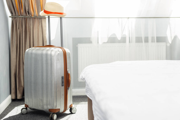 suitcase in light hotel room  on background,close up - Foto, Imagen