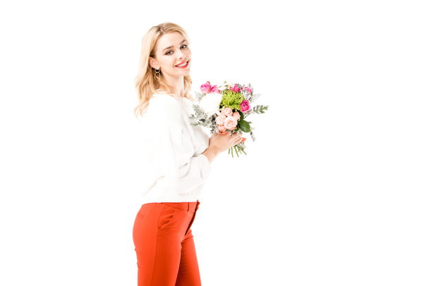 Smiling attractive woman with bouquet of beautiful flowers isolated on white - 写真・画像