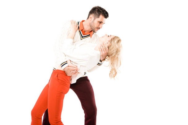 Happy attractive couple having fun and dancing isolated on white - Zdjęcie, obraz