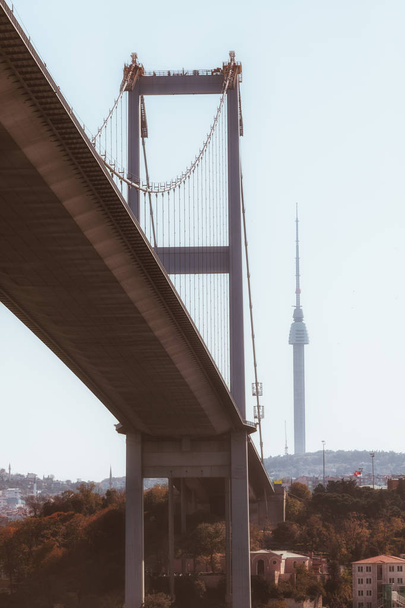 view of the bridge in istanbul from below with a taller tower on the background, turkey - Photo, Image