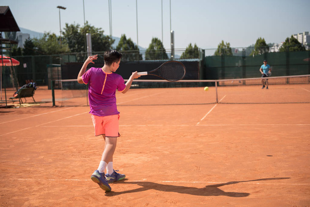 Young tennis player playing forehand - Foto, Imagem