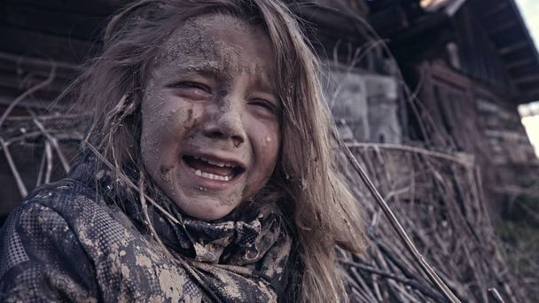 portrait of dirty little homeless girl crying  - Фото, изображение