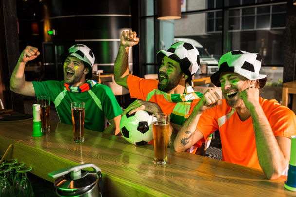Football fans cheering and screaming in bar - Photo, Image