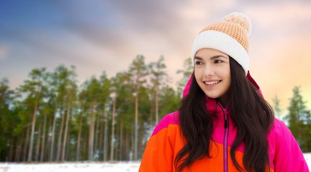 happy teenage girl in winter clothes outdoors - Foto, Imagen