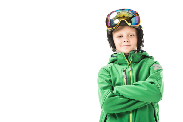 Preteen ragazzo in abiti da sci con le braccia incrociate sorridente e guardando la fotocamera isolata su bianco
 - Foto, immagini