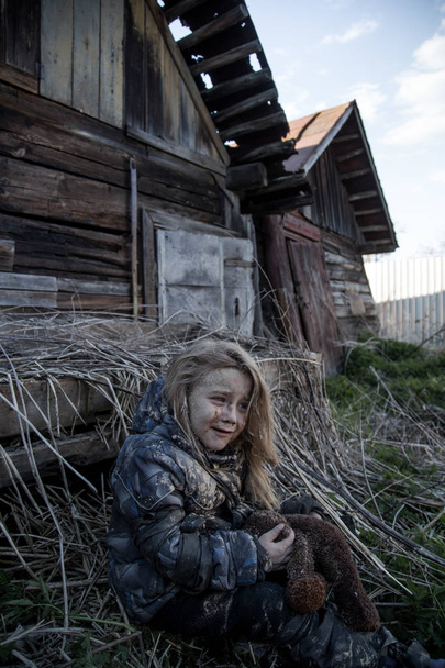 portrait of dirty little homeless girl crying - Photo, Image