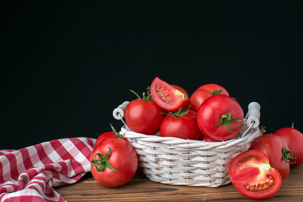 Red ripe tomatoes on wooden background - Fotoğraf, Görsel