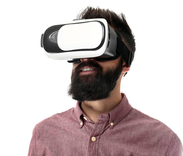 Man wearing virtual reality glasses on white background - Zdjęcie, obraz