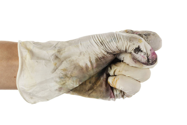 hand in dirty glove clenched into a fist. isolated on white backgroun - Zdjęcie, obraz